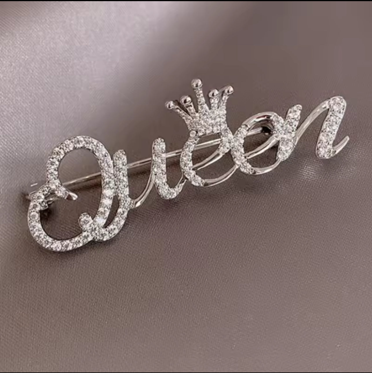 Queen brooches