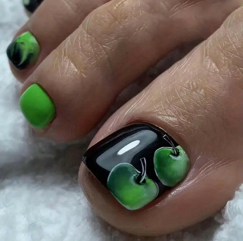 Black with apple design press on toe nails.