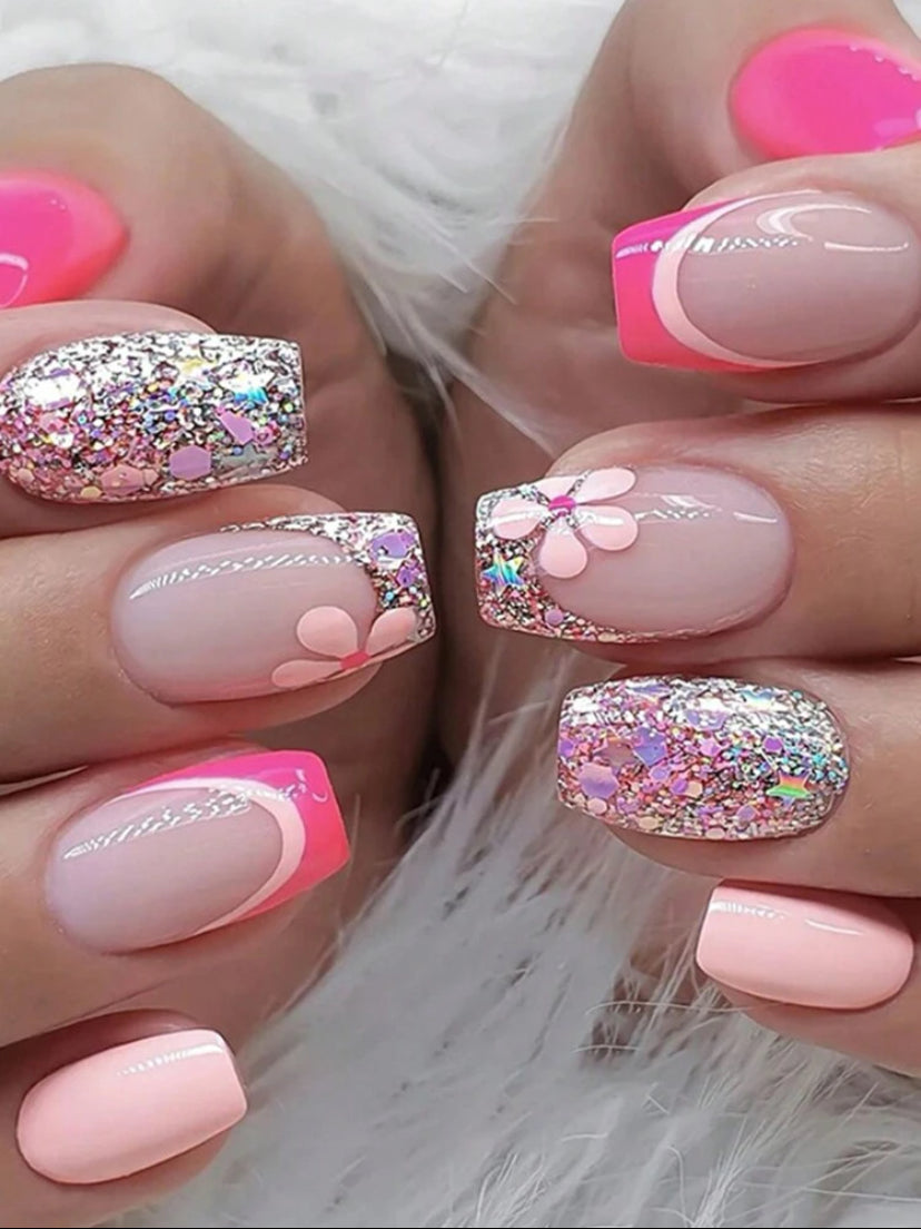Bright pink in French manicure design with cute flowers and glitter medium length press on nails