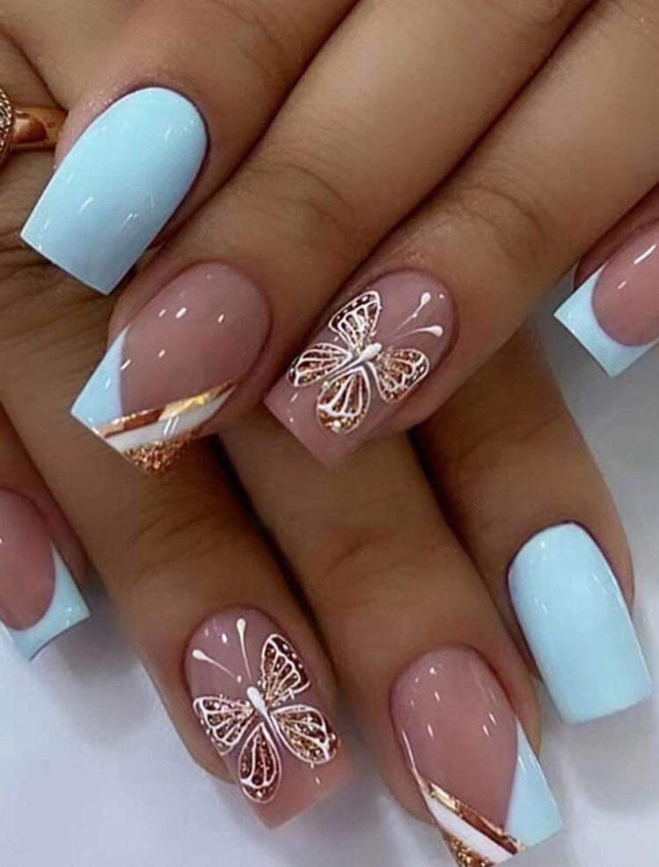 Baby blue French tip style with butterfly design press on nails
