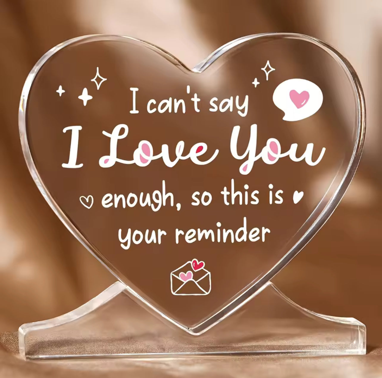 Heart shaped plaque with the words’ I can’t say I love you…..