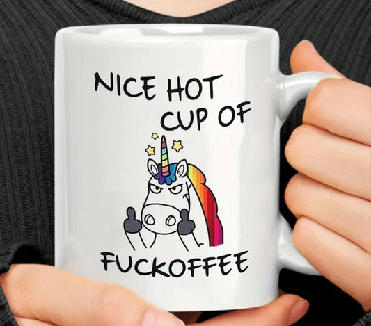 White ceramic mug with angry unicorn.