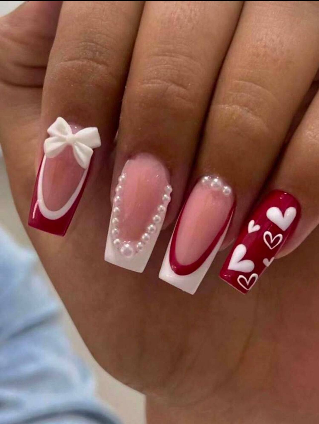 French tip style with heart printed and 3D bow press on nails