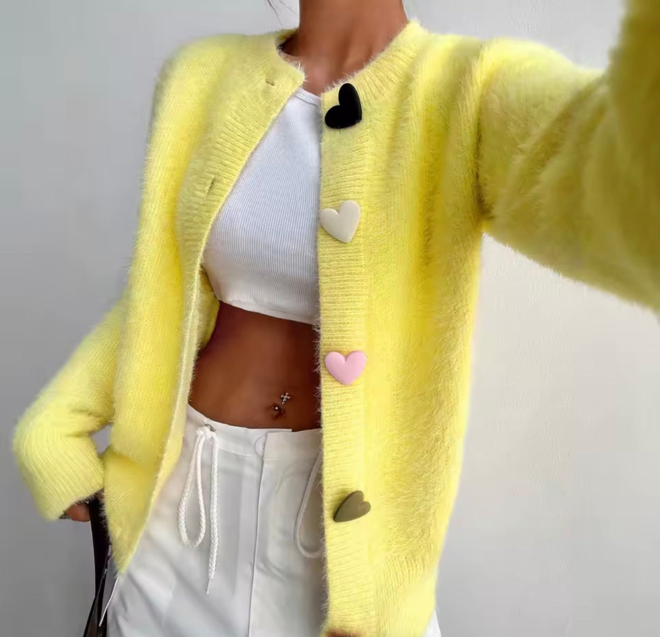 Yellow cardigan with heart button